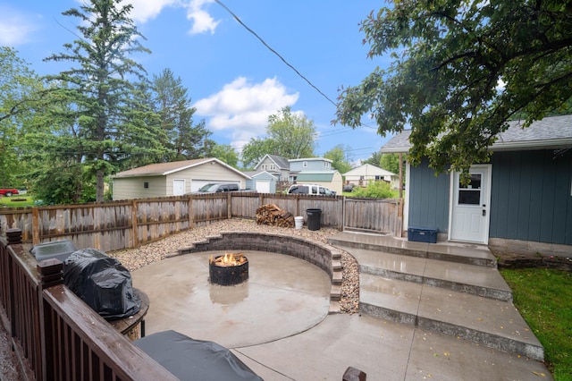 311 70th Ave W, Duluth, MN 55807 - fenced backyard featuring an outdoor fire pit and a patio