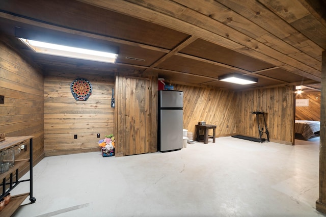 311 70th Ave W, Duluth, MN 55807 - finished basement with freestanding refrigerator, wooden walls, and wood ceiling