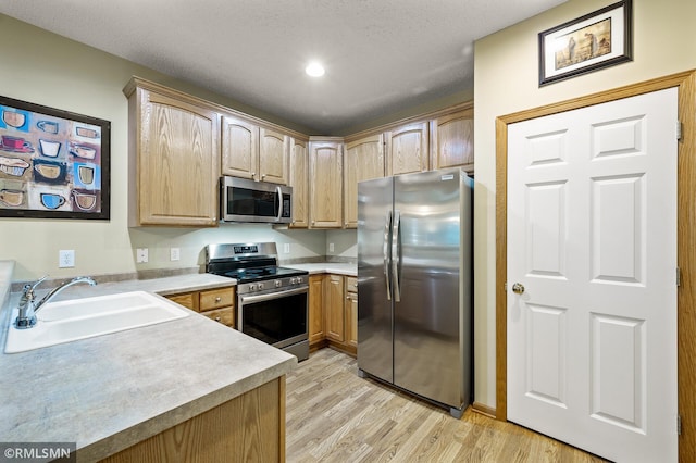 20177 Farnham Ln N, Forest Lake, MN 55025 - kitchen with stainless steel appliances, light wood-style floors, light countertops, light brown cabinetry, and recessed lighting