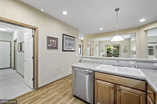 20177 Farnham Ln N, Forest Lake, MN 55025 - kitchen featuring dishwasher, light wood-style floors, light countertops, pendant lighting, and plenty of natural light