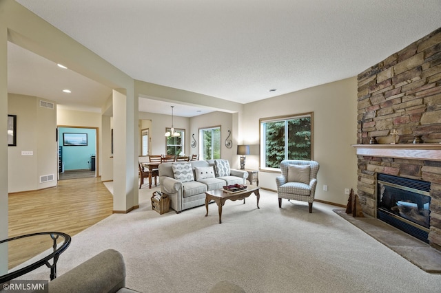 20177 Farnham Ln N, Forest Lake, MN 55025 - living room with light colored carpet, a fireplace, and recessed lighting
