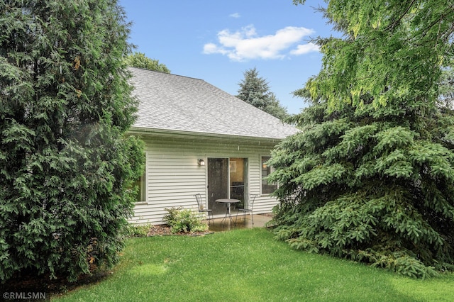 20177 Farnham Ln N, Forest Lake, MN 55025 - rear view of house with roof with shingles and a lawn