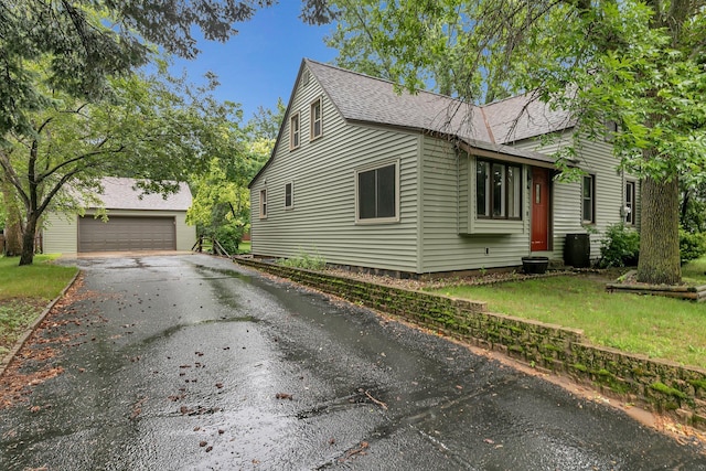 608 Summit Ave S, Sauk Rapids, MN 56379 - view of home's exterior with roof with shingles, an outdoor structure, and a yard