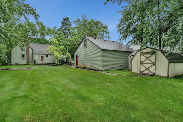 608 Summit Ave S, Sauk Rapids, MN 56379 - view of grassy yard featuring a shed
