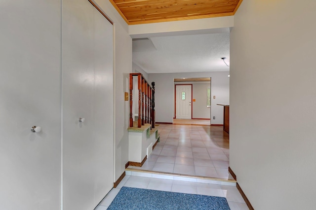 608 Summit Ave S, Sauk Rapids, MN 56379 - hallway featuring stairway, light tile patterned floors, and wooden ceiling