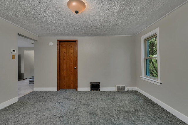 608 Summit Ave S, Sauk Rapids, MN 56379 - spare room featuring a textured ceiling, carpet flooring, and a smoke detector