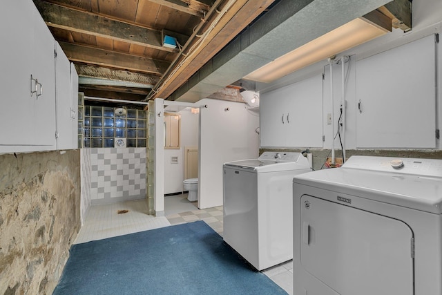 608 Summit Ave S, Sauk Rapids, MN 56379 - laundry room with washer and dryer, cabinet space, and light flooring