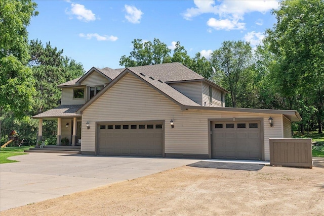 N6386 1317th St, Clifton Twp, WI 54021 - view of front of home featuring driveway, an attached garage, and a shingled roof
