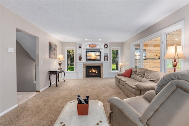 N6386 1317th St, Clifton Twp, WI 54021 - living room with light carpet, a textured ceiling, and a lit fireplace