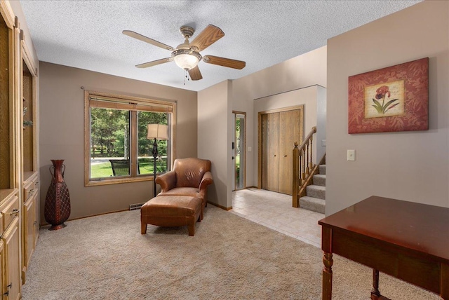 N6386 1317th St, Clifton Twp, WI 54021 - living area featuring stairway, light colored carpet, ceiling fan, and a textured ceiling