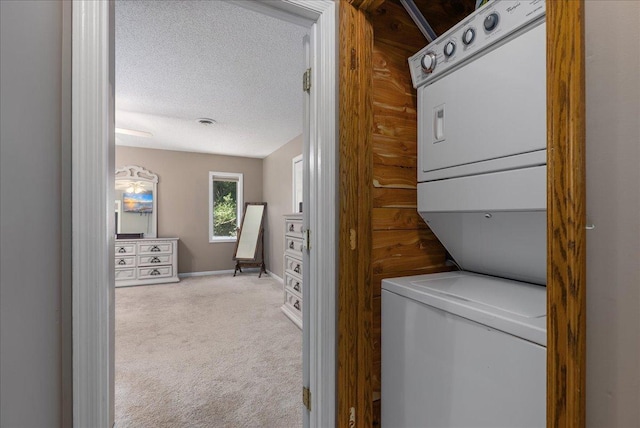 N6386 1317th St, Clifton Twp, WI 54021 - laundry area featuring stacked washing machine and dryer, carpet floors, and a textured ceiling