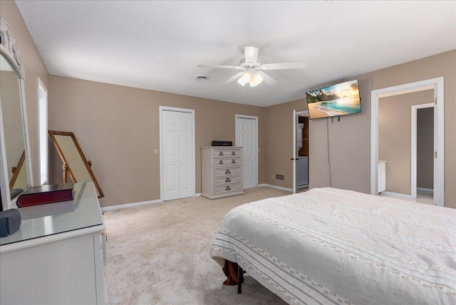 N6386 1317th St, Clifton Twp, WI 54021 - bedroom with two closets, light carpet, and a ceiling fan