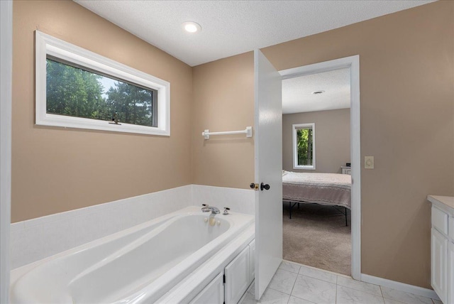 N6386 1317th St, Clifton Twp, WI 54021 - ensuite bathroom featuring a garden tub, vanity, a textured ceiling, and marble finish floors