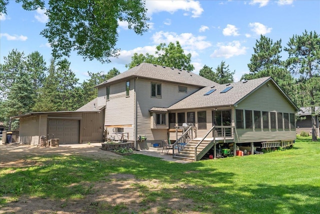 N6386 1317th St, Clifton Twp, WI 54021 - rear view of property featuring a sunroom, roof with shingles, a patio area, a lawn, and stairway