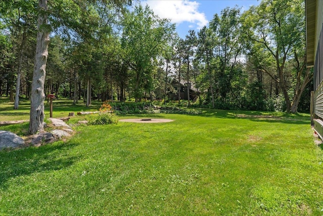N6386 1317th St, Clifton Twp, WI 54021 - view of green lawn with an outdoor fire pit