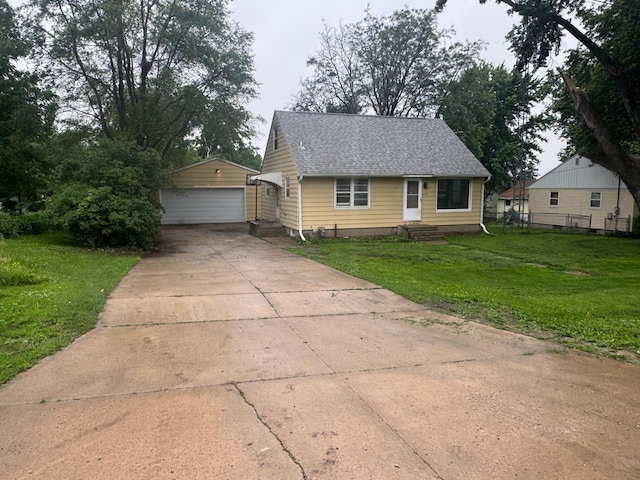 2100 14th St SE, Rochester, MN 55904 - bungalow with entry steps, an outbuilding, a garage, and a shingled roof