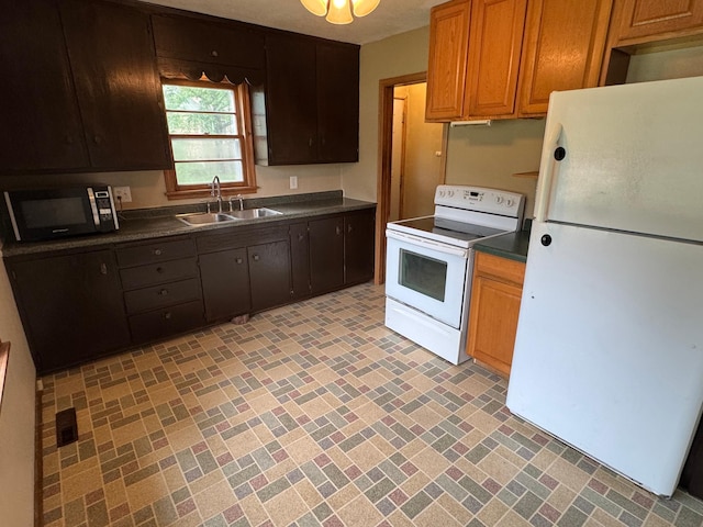 2100 14th St SE, Rochester, MN 55904 - kitchen with white appliances and dark countertops