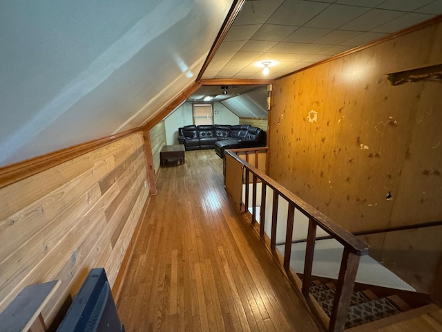 2100 14th St SE, Rochester, MN 55904 - bonus room with wood walls, hardwood / wood-style floors, and vaulted ceiling