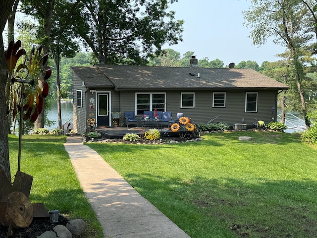 2029 Richardson Ct, Georgetown Twp, WI 54853 - ranch-style house with an outdoor living space, a front lawn, a chimney, roof with shingles, and a deck with water view