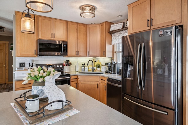 2029 Richardson Ct, Georgetown Twp, WI 54853 - kitchen with appliances with stainless steel finishes, light countertops, decorative backsplash, and a textured ceiling