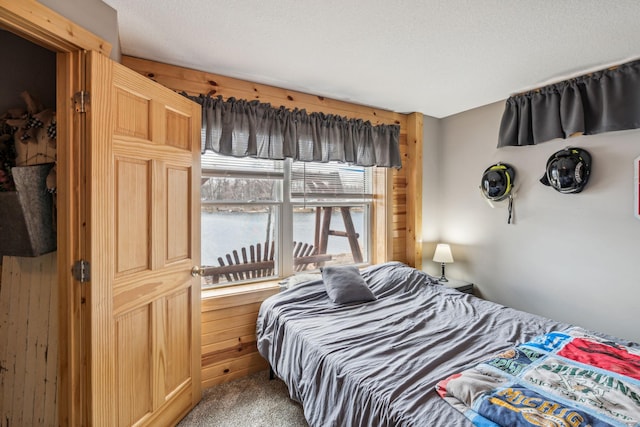 2029 Richardson Ct, Georgetown Twp, WI 54853 - bedroom featuring carpet flooring and wood walls