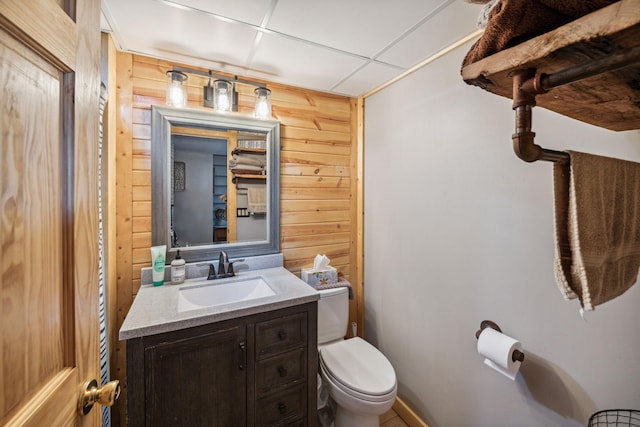 2029 Richardson Ct, Georgetown Twp, WI 54853 - bathroom featuring wood walls and vanity