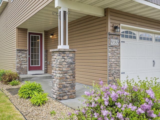 9185 Golden Pond Ln N, Monticello, MN 55362 - entrance to property featuring stone siding and covered porch