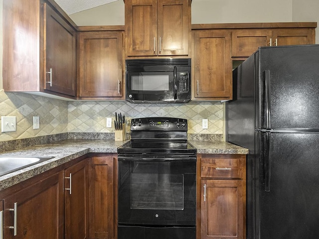 9185 Golden Pond Ln N, Monticello, MN 55362 - kitchen with black appliances, tasteful backsplash, and dark countertops