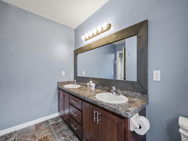 9185 Golden Pond Ln N, Monticello, MN 55362 - bathroom with baseboards and double vanity