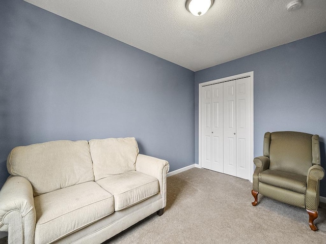 9185 Golden Pond Ln N, Monticello, MN 55362 - living area featuring carpet and a textured ceiling