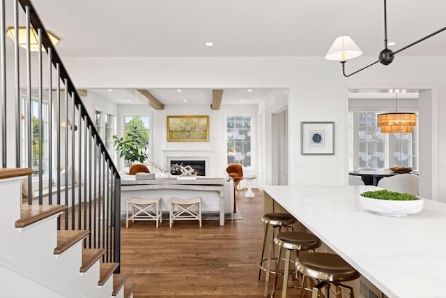 956 Mississippi River Blvd S, Saint Paul, MN 55116 - dining room with stairs, dark wood-style floors, a fireplace, healthy amount of natural light, and recessed lighting