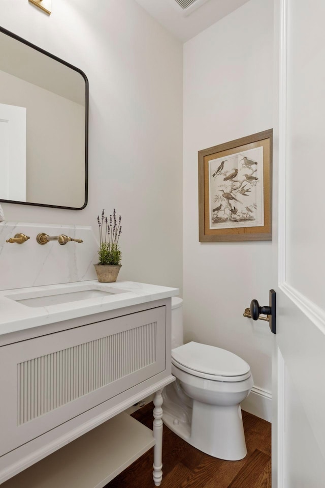 956 Mississippi River Blvd S, Saint Paul, MN 55116 - half bath featuring vanity and wood finished floors