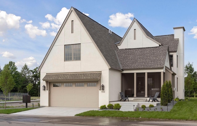956 Mississippi River Blvd S, Saint Paul, MN 55116 - view of front facade featuring roof with shingles, driveway, stucco siding, and an attached garage