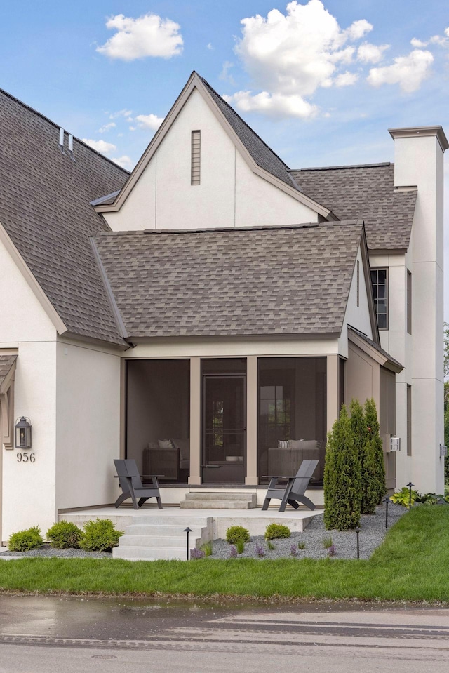 956 Mississippi River Blvd S, Saint Paul, MN 55116 - rear view of property featuring a shingled roof, a patio area, and stucco siding