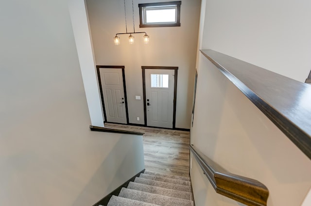 893 Grant St, Ellsworth, WI 54011 - entrance foyer featuring plenty of natural light, wood finished floors, stairs, and a high ceiling