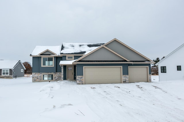 893 Grant St, Ellsworth, WI 54011 - view of front facade with stone siding and a garage