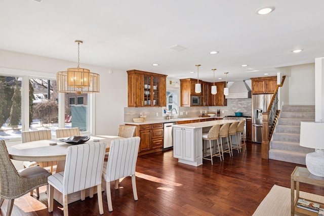 2807 Mckenzie Point Rd, Minnetonka, MN 55391 - dining room featuring dark wood-type flooring, stairs, a chandelier, and recessed lighting