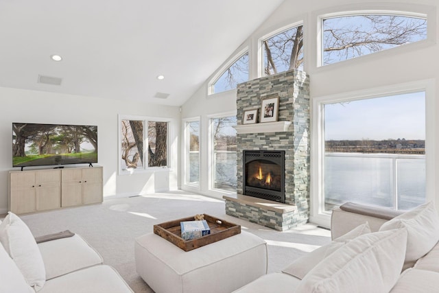 2807 Mckenzie Point Rd, Minnetonka, MN 55391 - carpeted living room with high vaulted ceiling, a fireplace, and recessed lighting