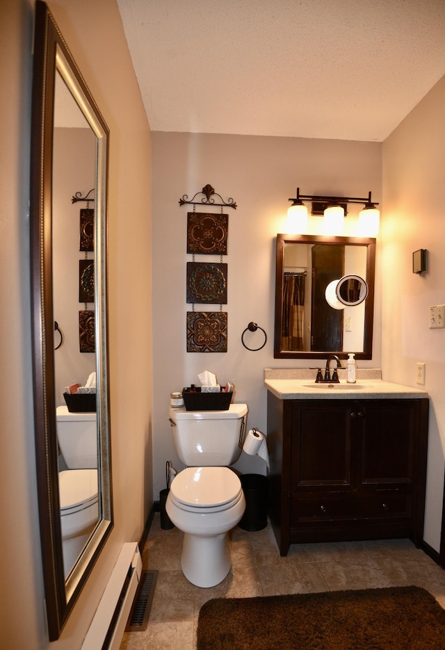 22761 105th Ave, Milaca, MN 56353 - full bath with vanity, baseboard heating, and tile patterned floors