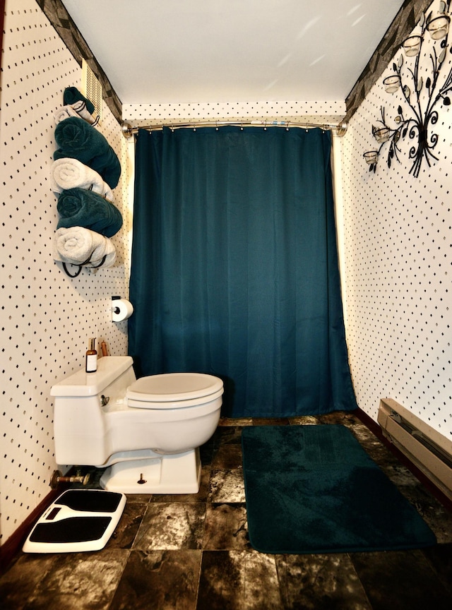 22761 105th Ave, Milaca, MN 56353 - bathroom featuring toilet and a baseboard heating unit