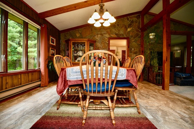 22761 105th Ave, Milaca, MN 56353 - dining space featuring a chandelier, wooden walls, and a baseboard radiator