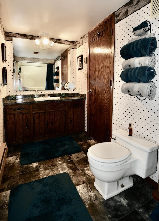 22761 105th Ave, Milaca, MN 56353 - bathroom featuring wallpapered walls and vanity