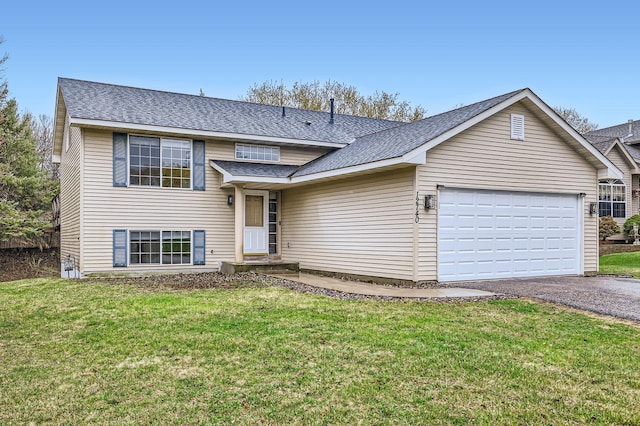 12740 Eveleth Path, Apple Valley, MN 55124 - tri-level home featuring driveway, a garage, roof with shingles, and a front yard