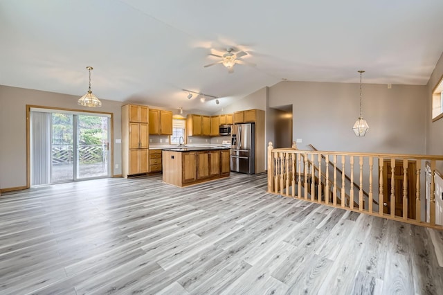 12740 Eveleth Path, Apple Valley, MN 55124 - kitchen featuring stainless steel appliances, vaulted ceiling, light wood-style flooring, and a ceiling fan