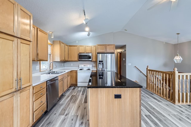 12740 Eveleth Path, Apple Valley, MN 55124 - kitchen featuring stainless steel appliances, light wood-type flooring, light brown cabinets, a center island, and lofted ceiling