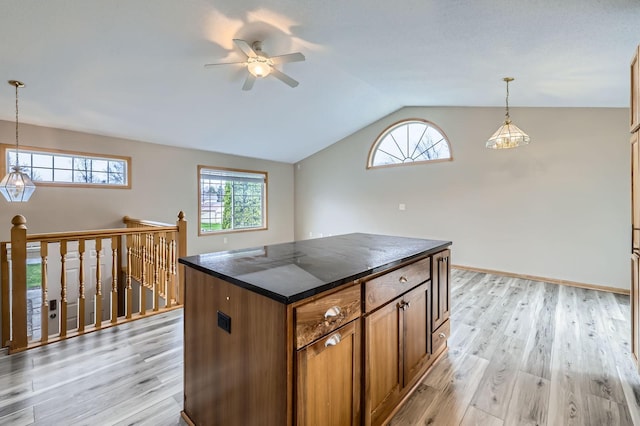 12740 Eveleth Path, Apple Valley, MN 55124 - kitchen featuring dark countertops, lofted ceiling, light wood-style flooring, ceiling fan, and brown cabinetry