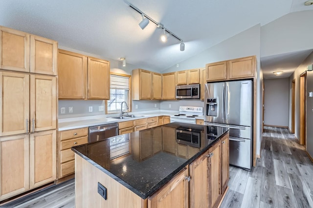 12740 Eveleth Path, Apple Valley, MN 55124 - kitchen with appliances with stainless steel finishes, light brown cabinetry, vaulted ceiling, rail lighting, and light wood-style flooring