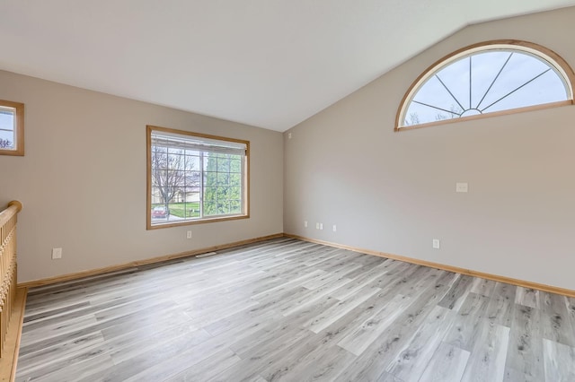 12740 Eveleth Path, Apple Valley, MN 55124 - spare room with light wood-style flooring and vaulted ceiling
