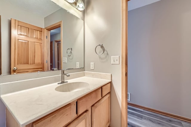12740 Eveleth Path, Apple Valley, MN 55124 - bathroom with wood finished floors and vanity