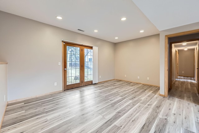 12740 Eveleth Path, Apple Valley, MN 55124 - empty room featuring light wood-style floors, recessed lighting, and french doors